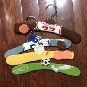 Set of 4 sports themed ZM International wooden hangers